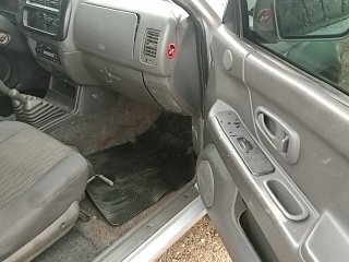 MMC L200 OUTDOOR Porta e interior passageiro